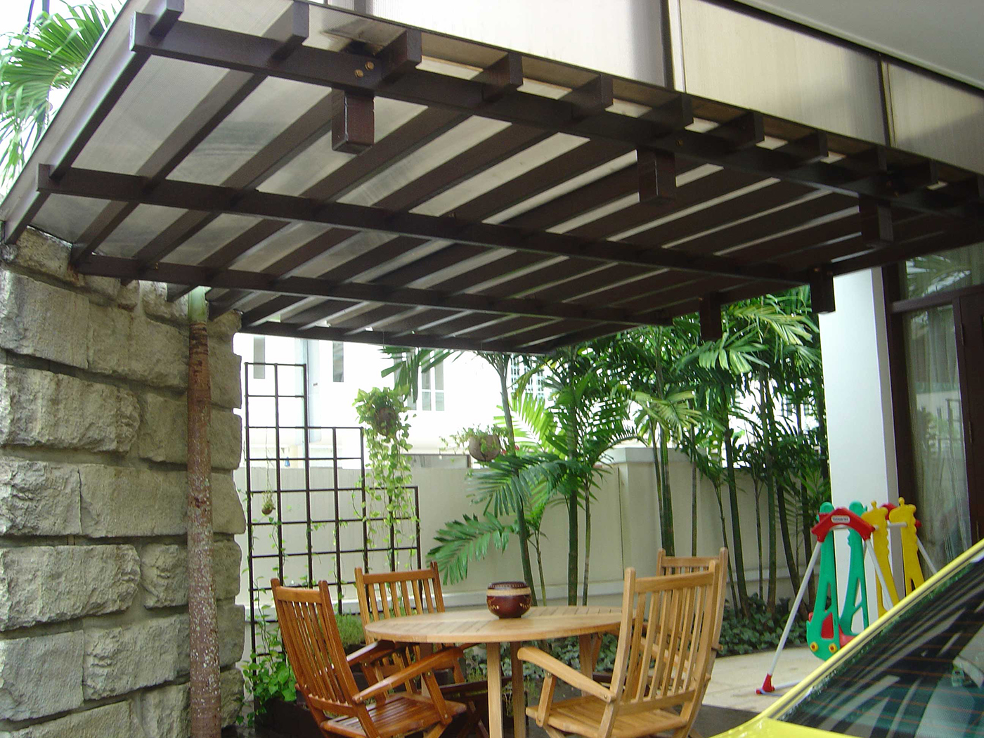Outdoor Timber Trellis With Wooden Chairs And Table